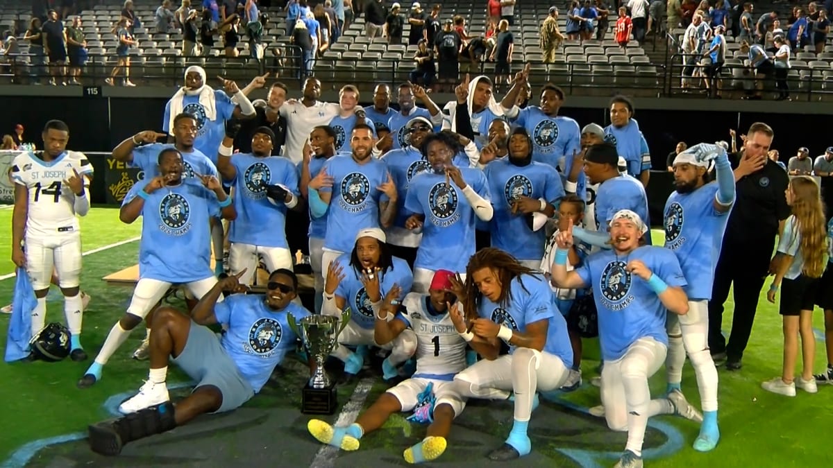 St. Joseph Goats indoor football team celebrating their first championship victory on field