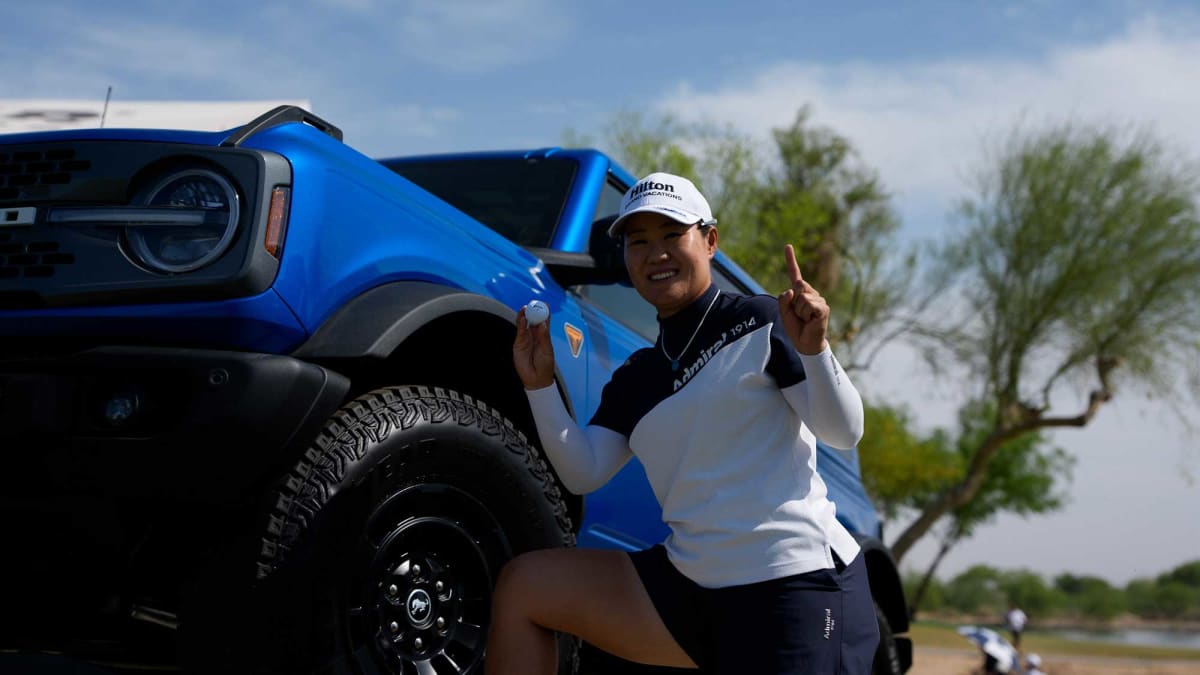 Professional golfer Nasa Hataoka celebrating on golf course after scoring hole-in-one