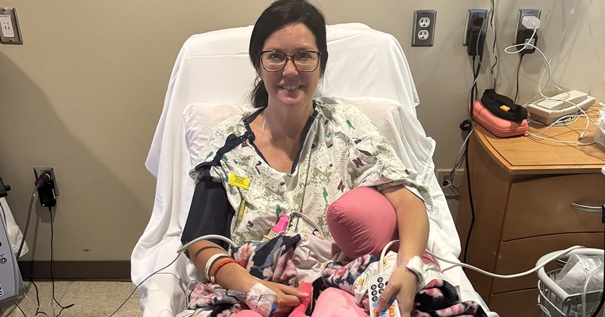 Young woman Brittany smiling in hospital gown preparing for lung cancer surgery with family support