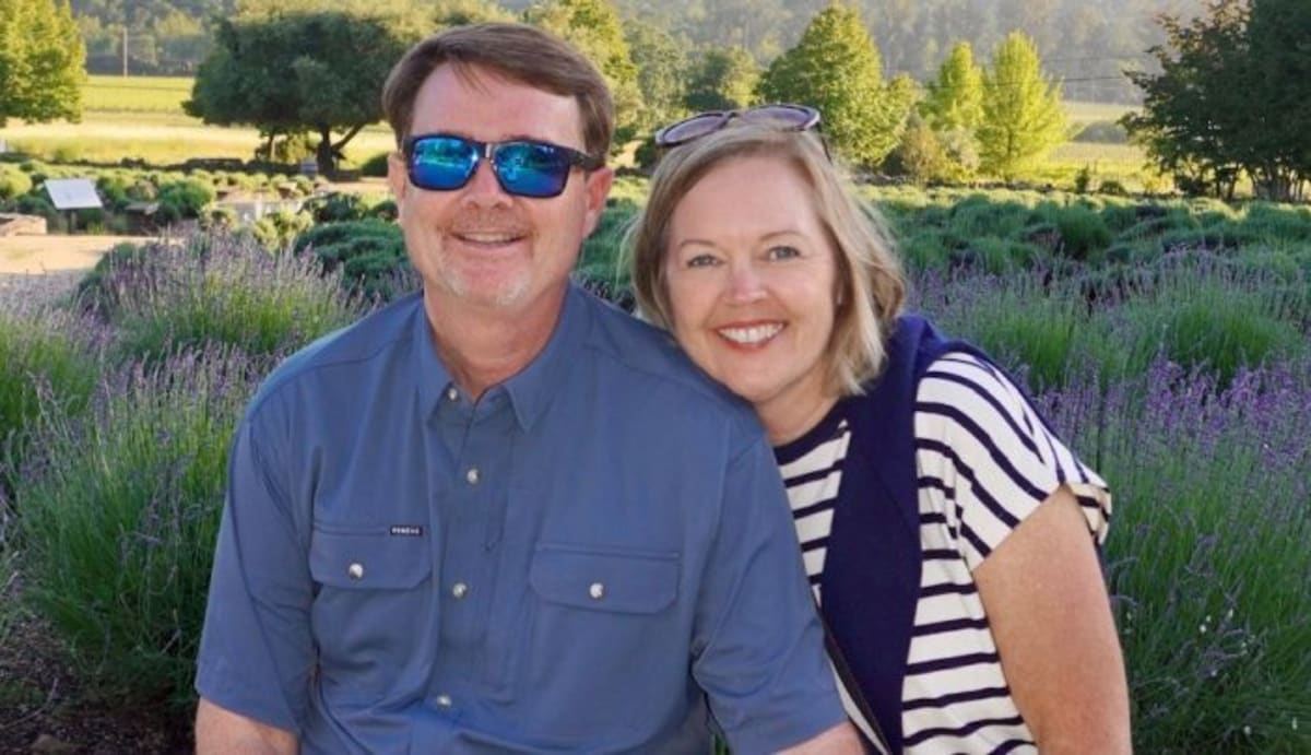 Mother and son embracing at wedding celebration after cancer treatment success