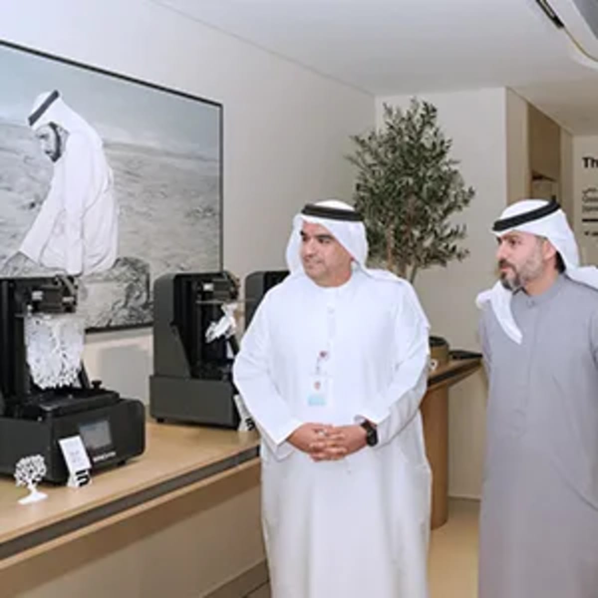 Emirati graduates displaying 3D printed prototypes and innovations at Al Ain Demo Day celebration