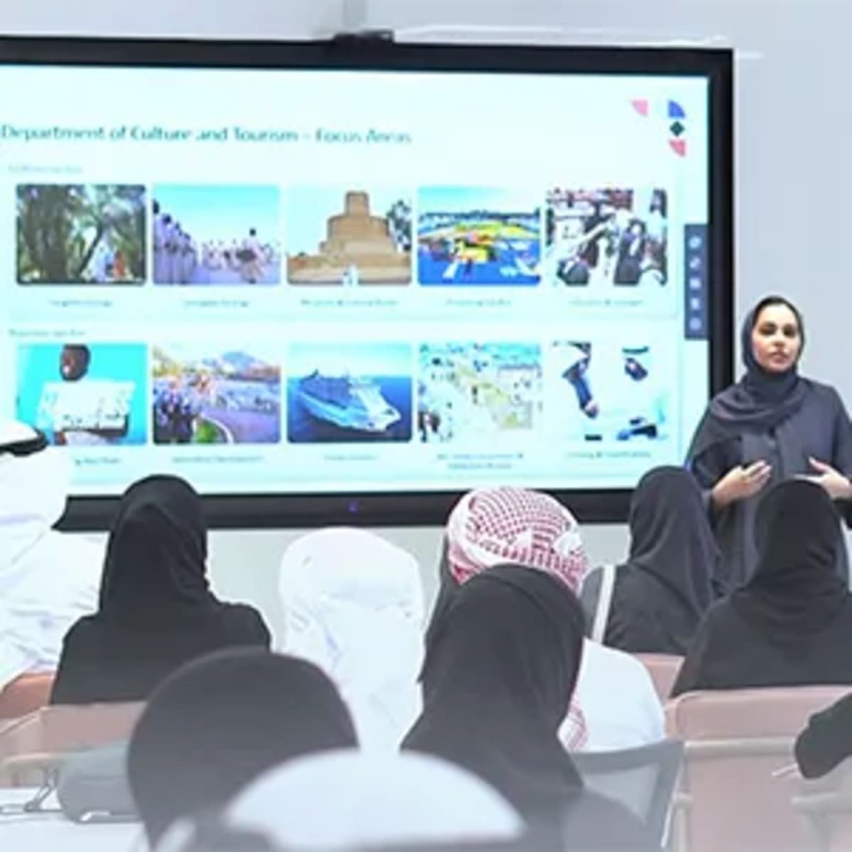 ** Emirati entrepreneurs collaborating during Ruwad Al Ain Bootcamp at MZN Hub facility
