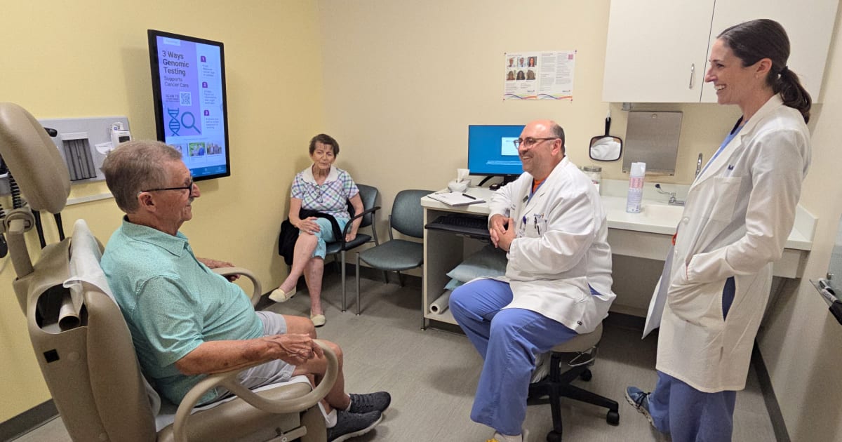 Elderly patient Mike Wess smiling with medical team after successful histotripsy tumor treatment