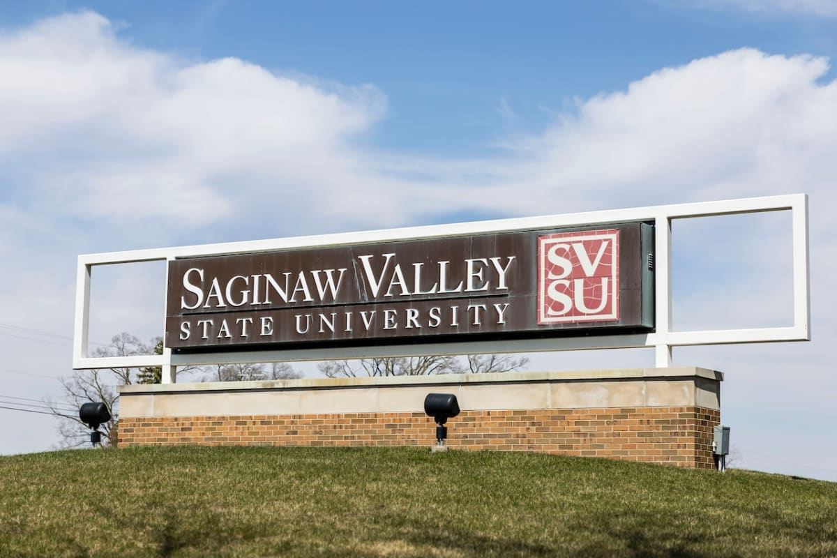 High school students presenting innovation project at Saginaw Valley State University competition