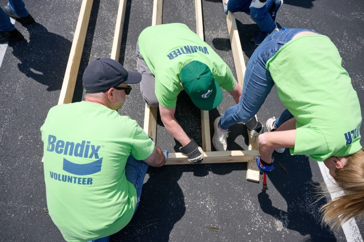 170 Workers Frame House in Parking Lot for Family in Need
