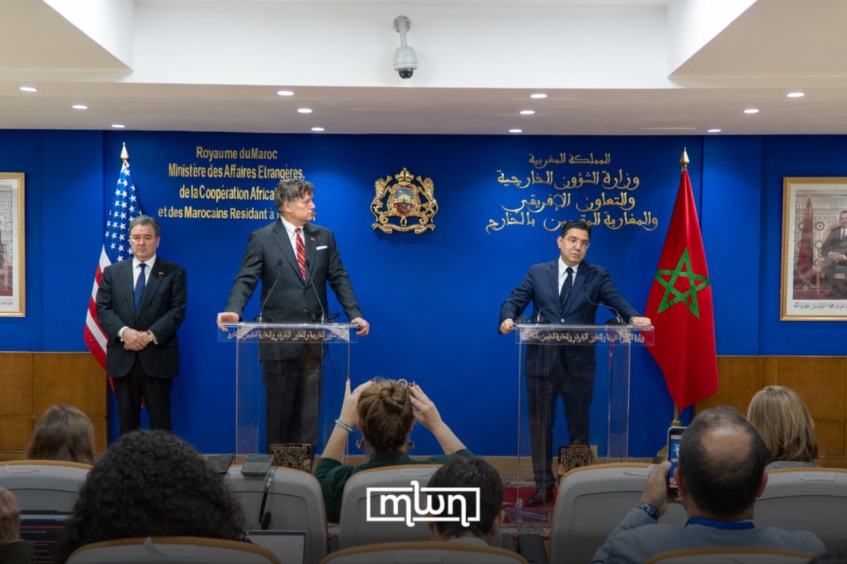 Moroccan and American officials shake hands after signing the Artemis Accords in Rabat