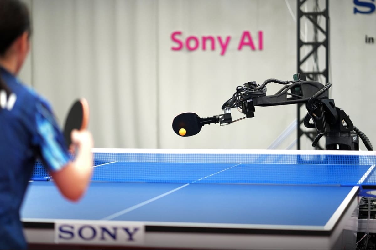 Sony's Ace robot with robotic arm positioned over table tennis table ready to play