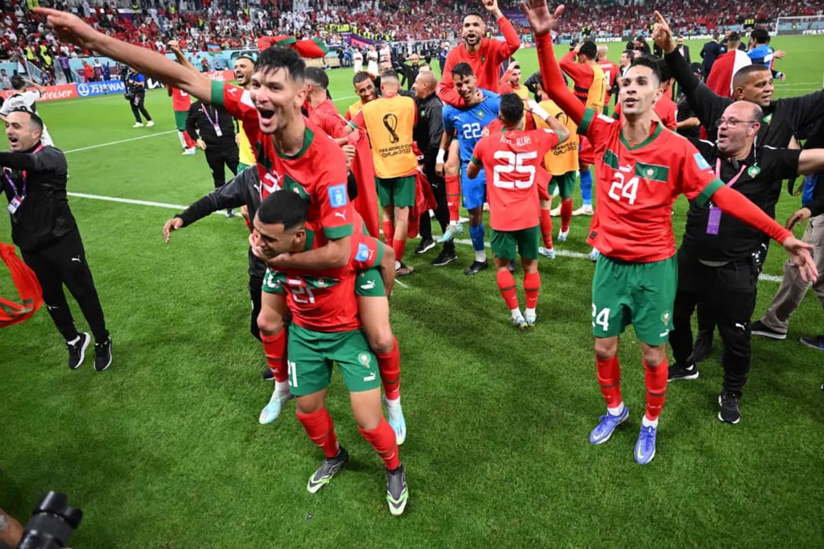 Morocco national football team players celebrating during their historic 2022 World Cup semifinal run