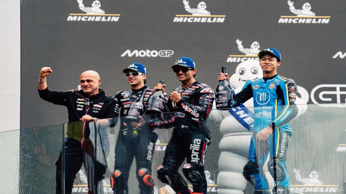 Ai Ogura celebrating on podium at Le Mans MotoGP French Grand Prix