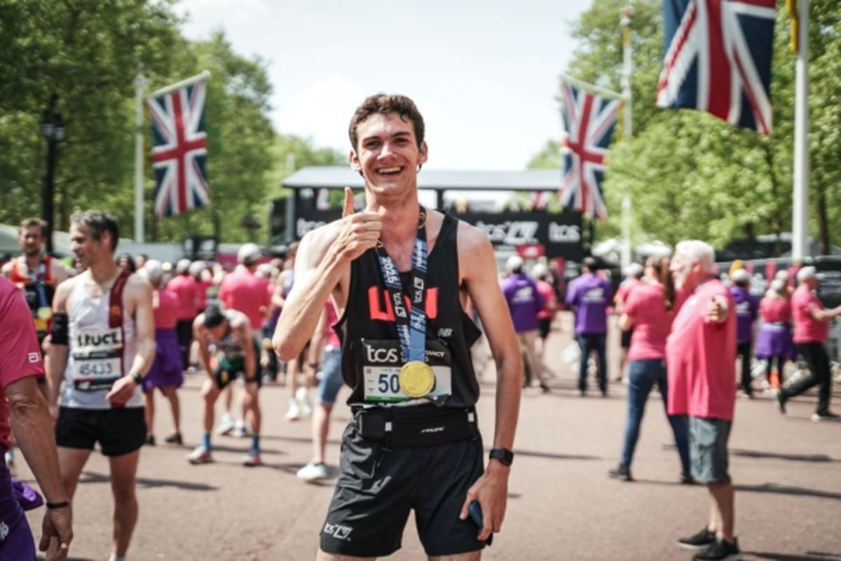 Young runner Sam Fetters celebrates completing Tokyo Marathon with medal and smile