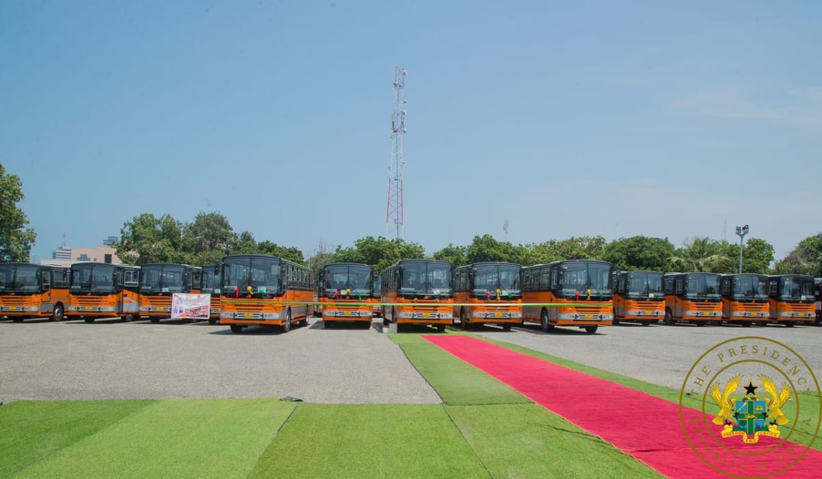 Modern Metro Mass Transit bus on busy Ghana street serving commuters during morning rush hour