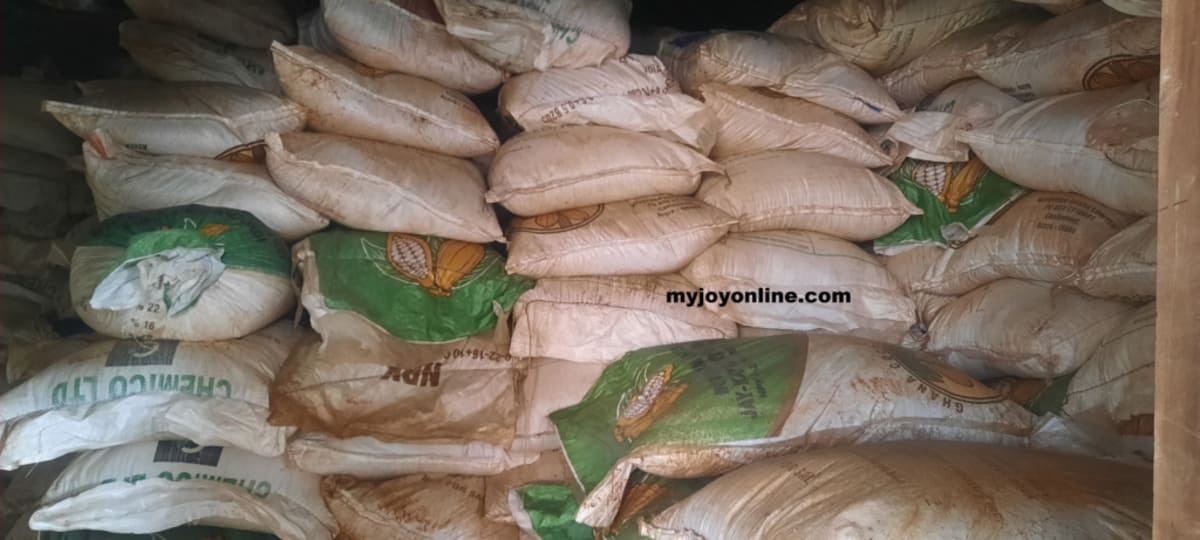 Bags of fertilizer stacked in warehouse awaiting distribution to Ghanaian farmers