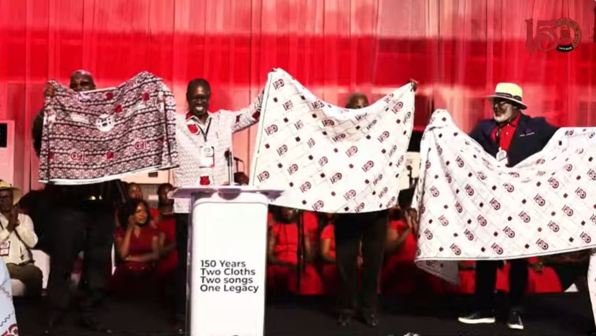 Models display colorful commemorative cloth designs for Mfantsipim School's 150th anniversary celebration in Ghana
