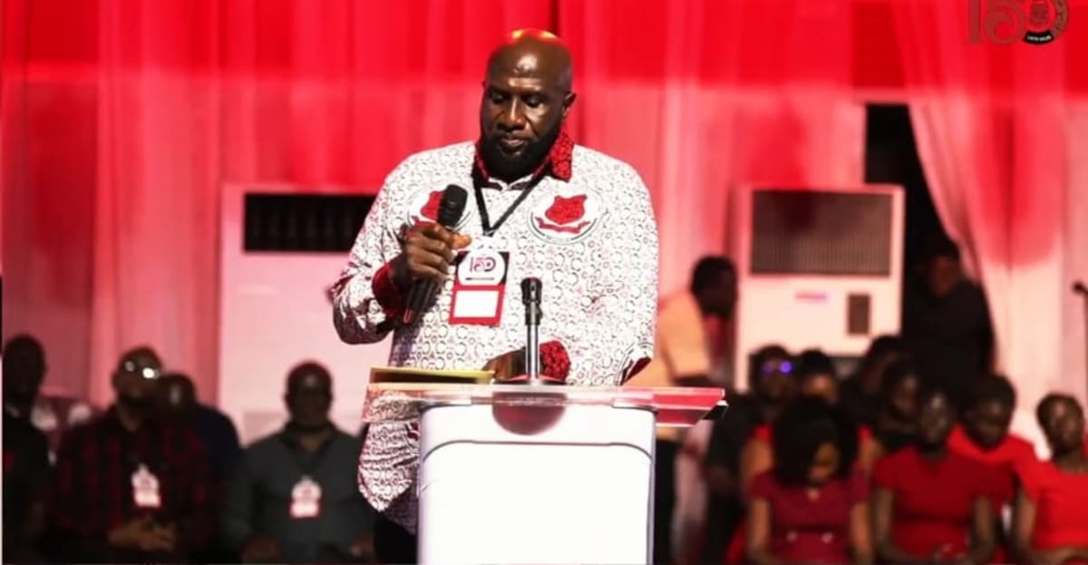 Models wearing colorful traditional outfits made from Mfantsipim School's 150th anniversary commemorative cloth designs