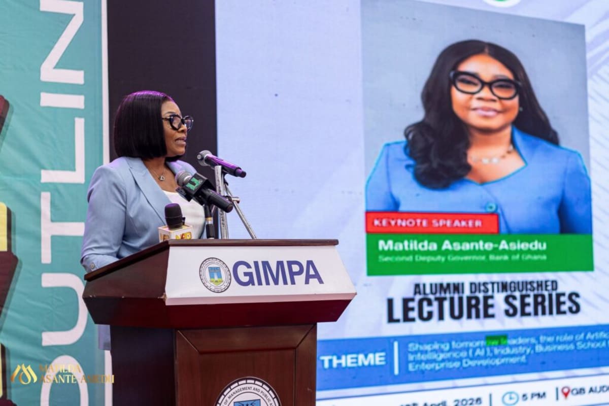 Matilda Asante-Asiedu speaking at podium to students at GIMPA university in Ghana