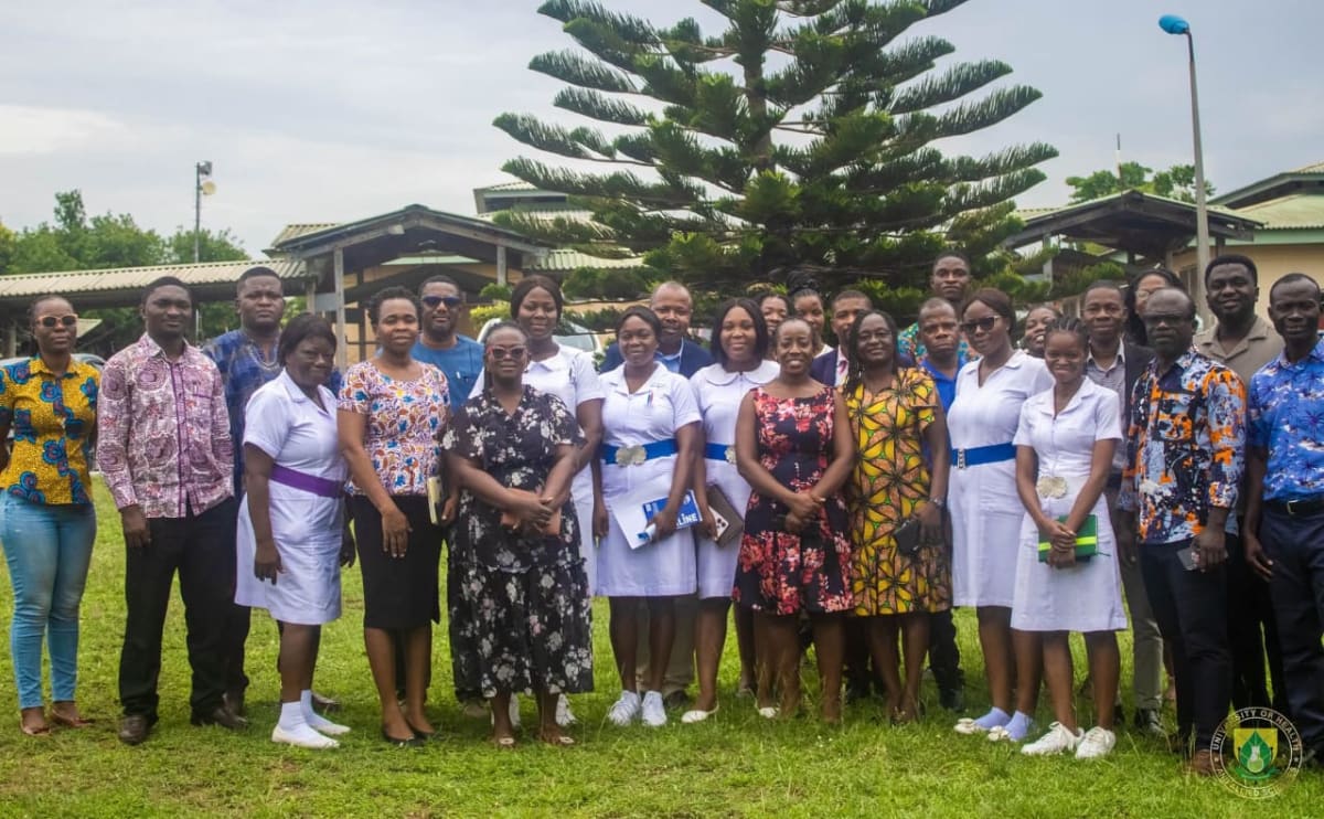 Healthcare workers caring for newborn baby in neonatal intensive care unit in Ghana