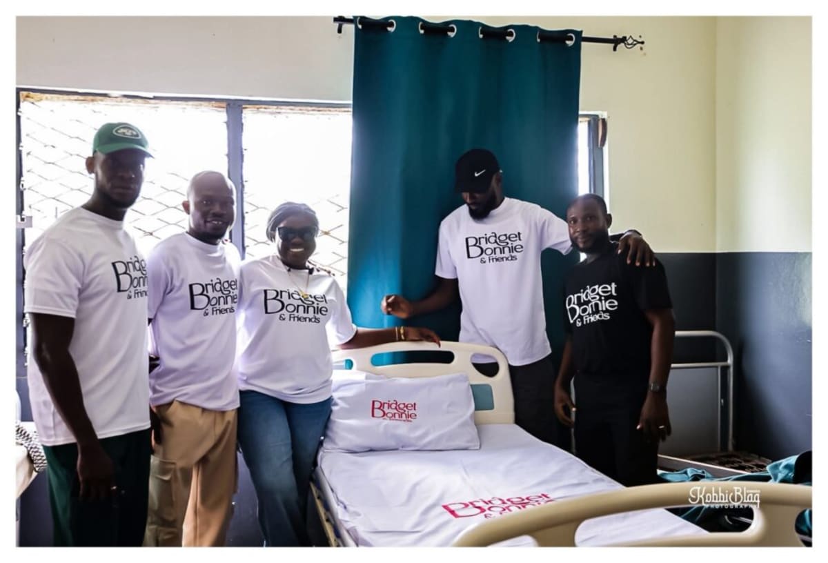 Healthcare workers receiving donated bedsheets and furniture at Kasseh Model Health Centre in Ada, Ghana