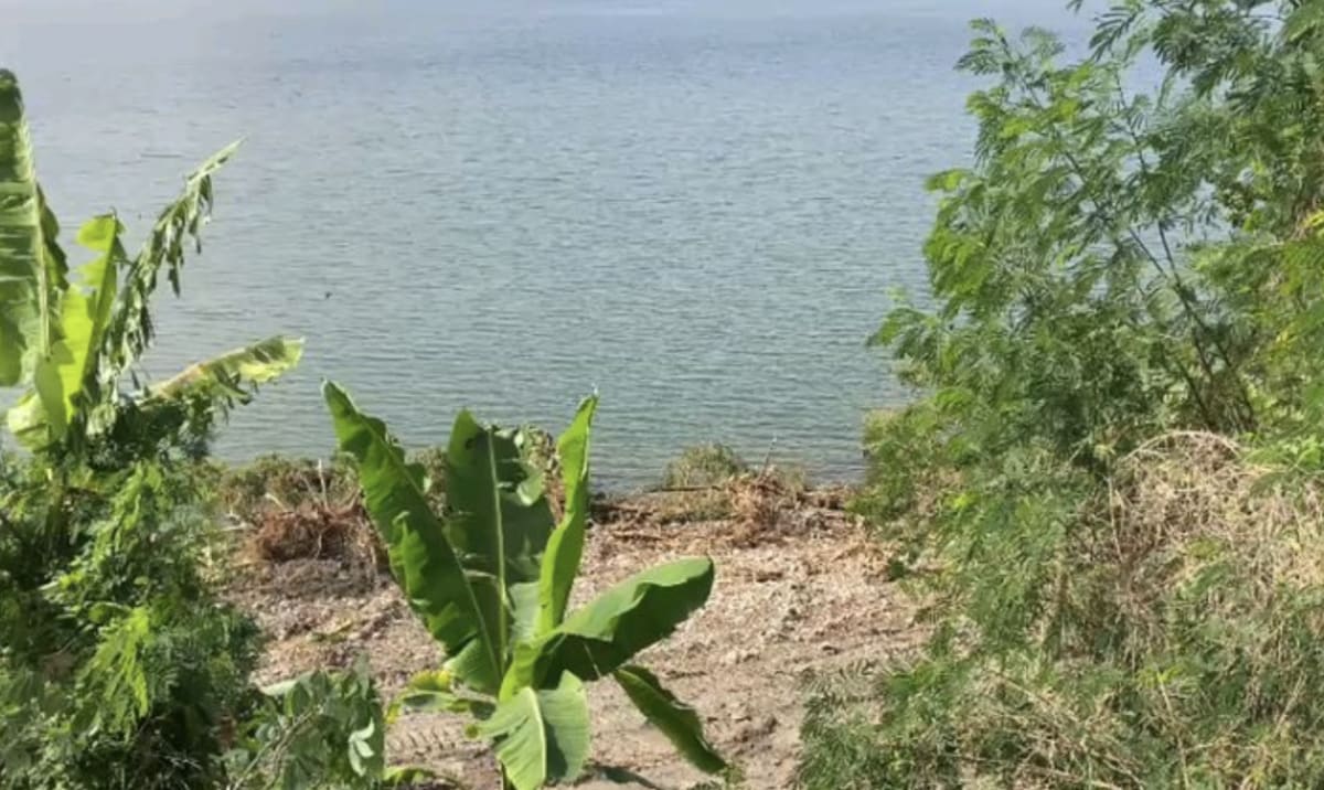 Aerial view of Lake Bosomtwe surrounded by lush green vegetation in Ghana's Ashanti Region