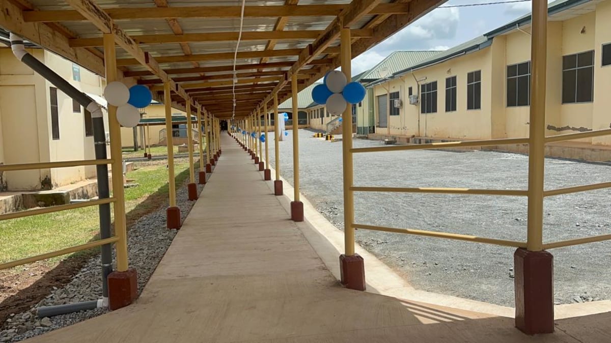 Covered hospital walkway connecting medical buildings at Asutifi North Government Hospital in Ghana