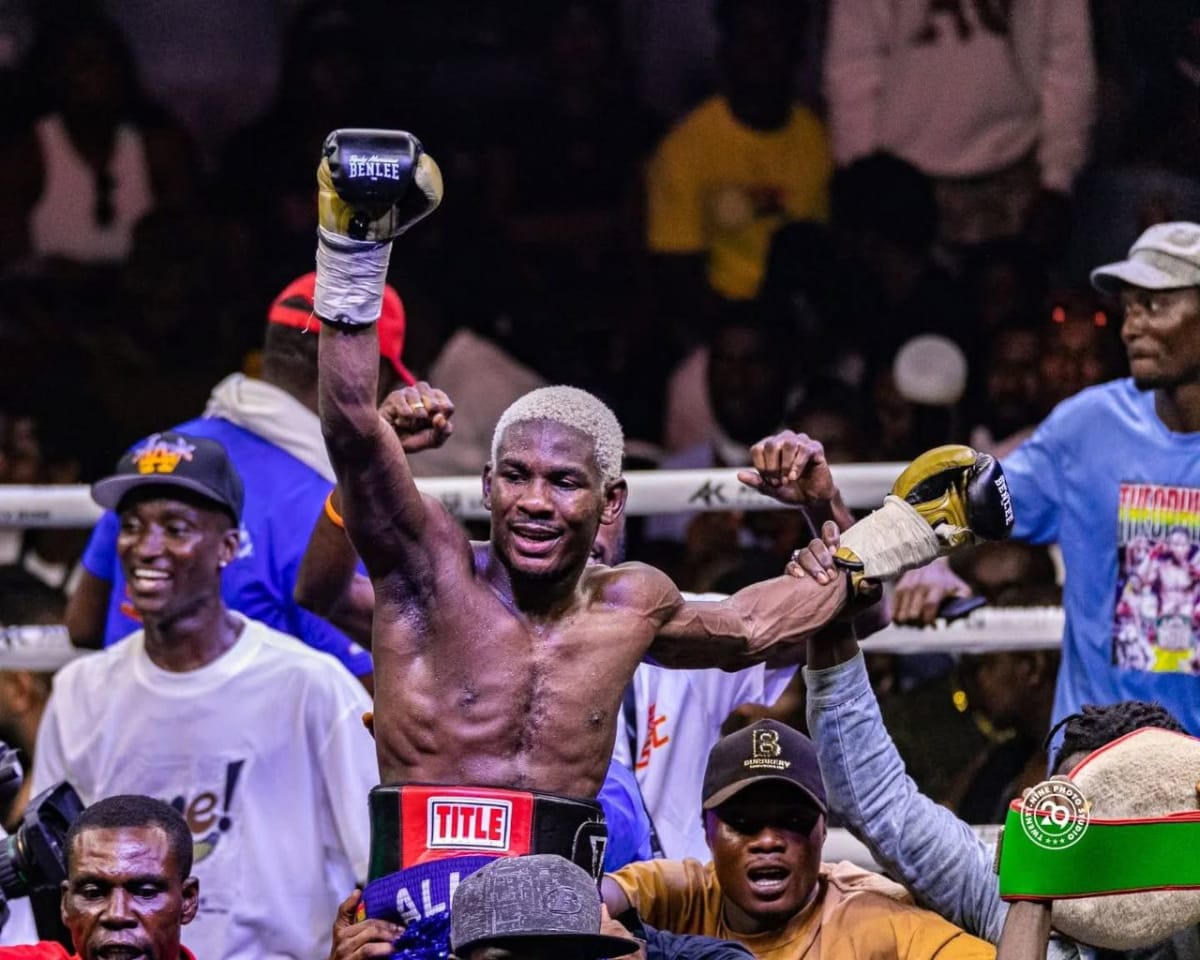 Theophilus Allotey celebrating with coach Ofori Asare after winning WBA Africa boxing title in Ghana
