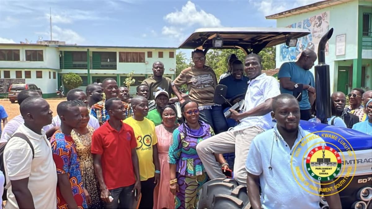 Ghanaian high school students learning modern agricultural techniques on campus farmland in South Tongu