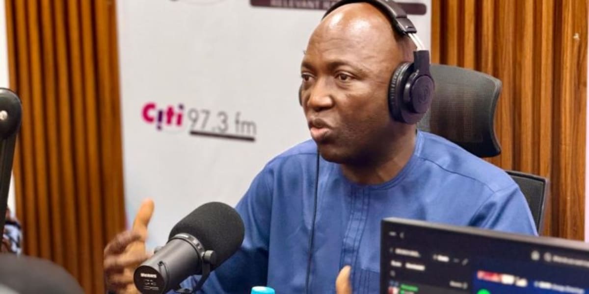 ** Person using mobile phone for digital money transfer in Ghana with security technology overlay