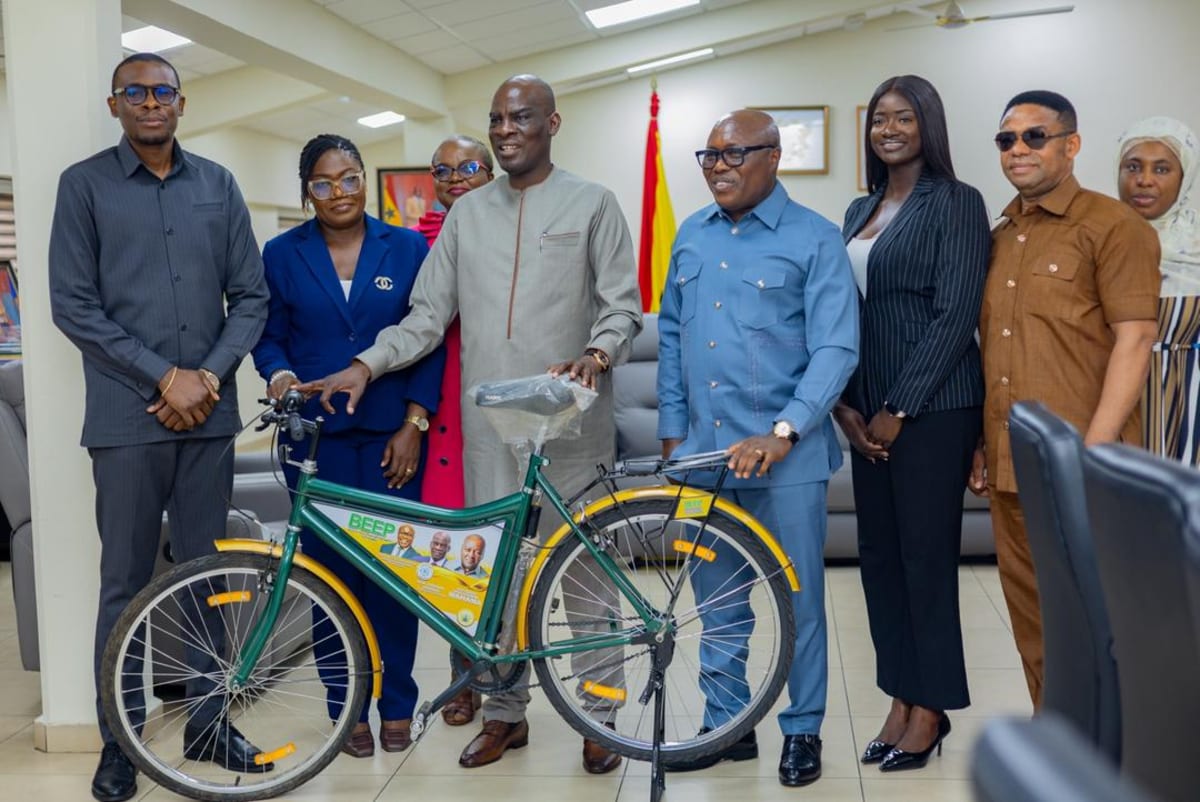 Ghana technical students standing with locally assembled bicycle at East Legon institute workshop