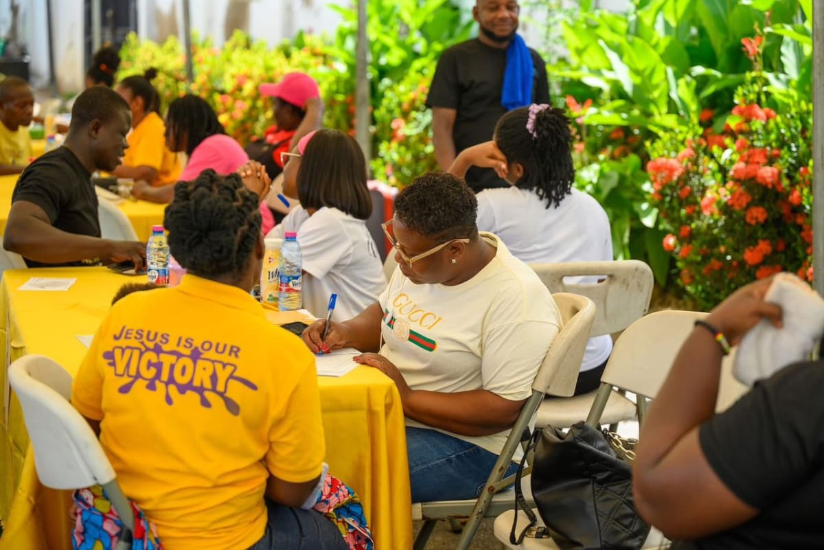 Community members receiving free medical health screenings at Victory Bible Church in Accra, Ghana