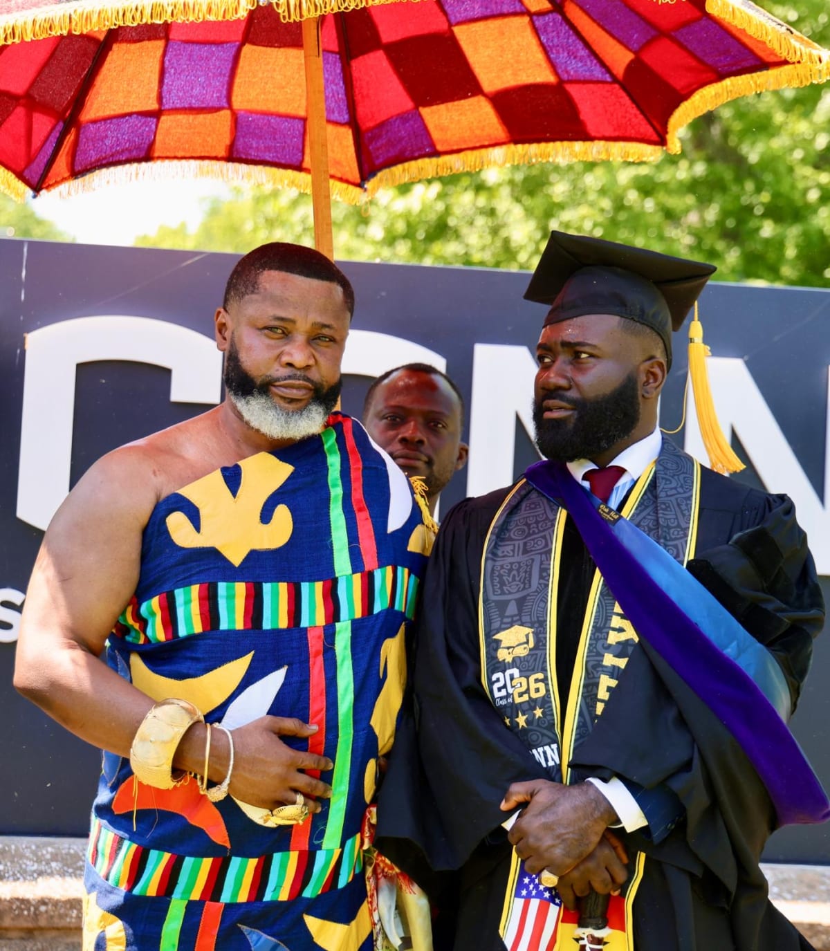 Okatakyie Afrifa-Mensah in graduation regalia at University of Connecticut commencement ceremony