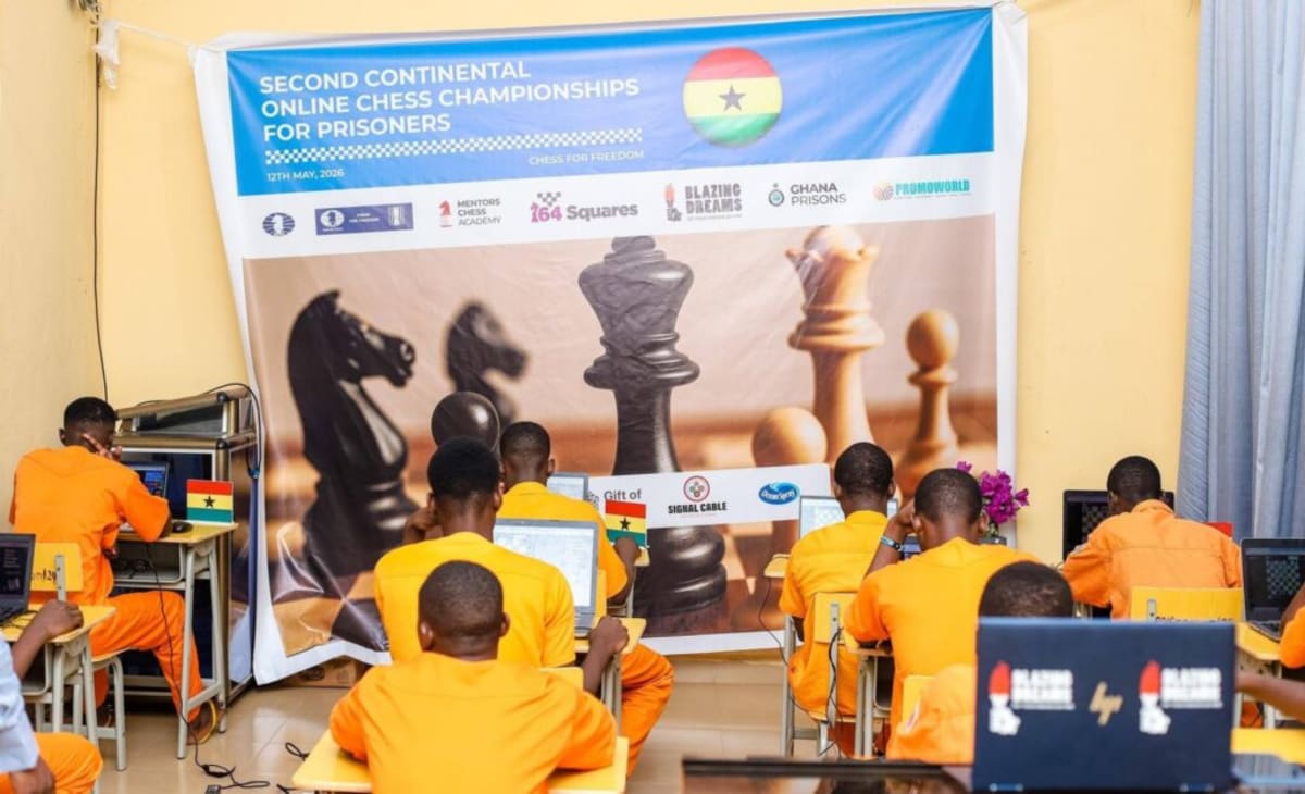 Inmates from Ghana playing chess during Continental Online Chess Championships for African prisoners