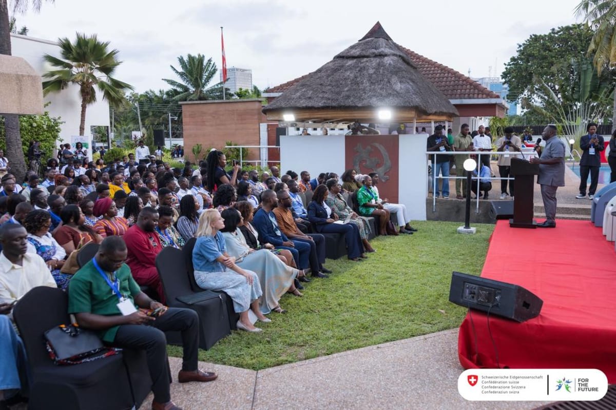 Young African leaders collaborating at FTF Impact Summit in Ghana conference hall