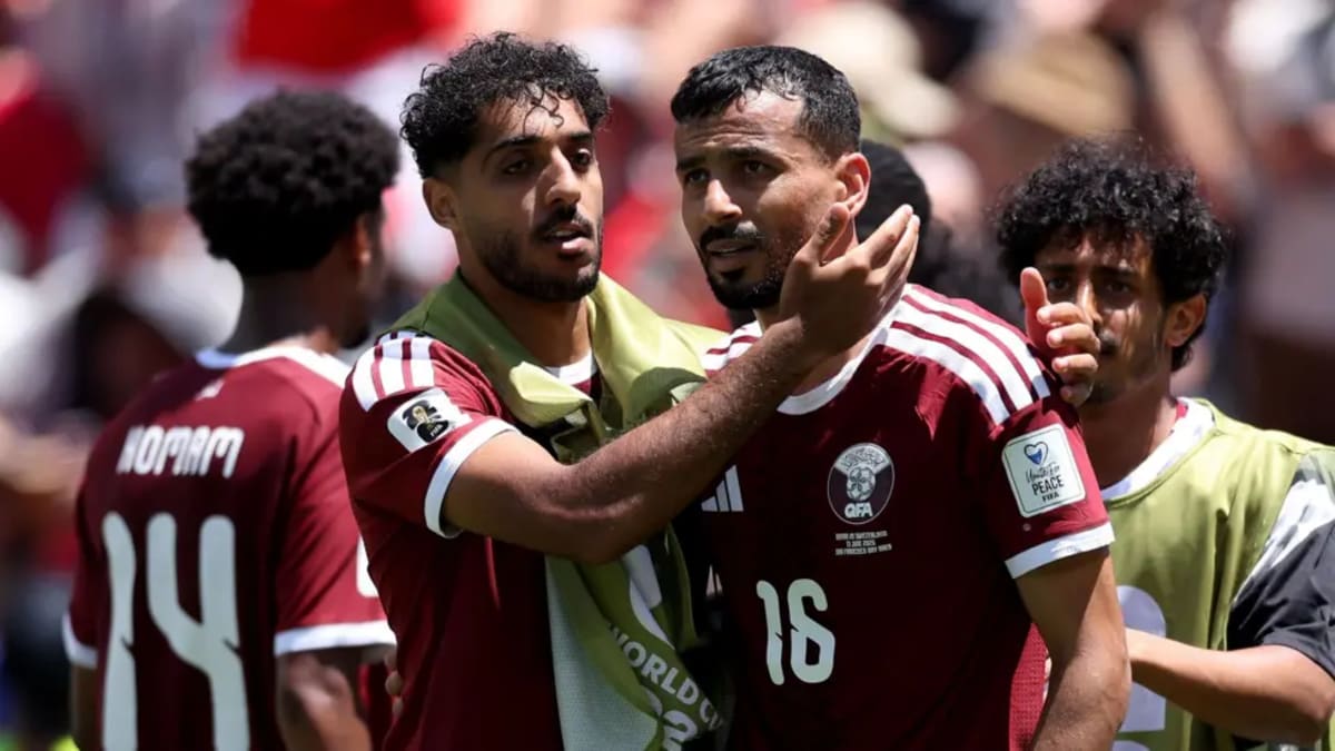 Qatar football players celebrate together after scoring dramatic late equalizer against Switzerland