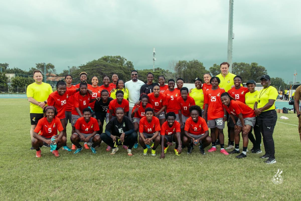 Asamoah Gyan speaking with Ghana Black Queens soccer players during training session