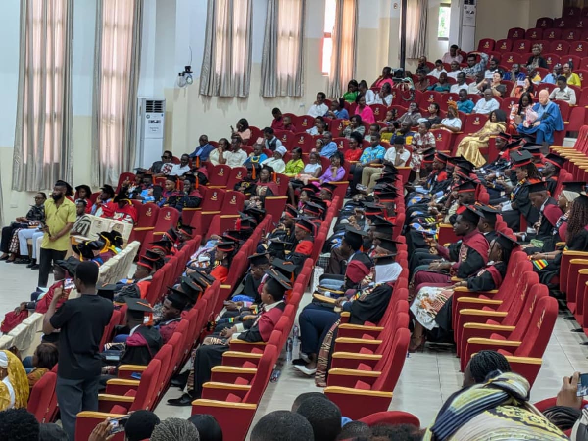 African students in graduation gowns celebrating at AIMS Ghana ceremony in Accra