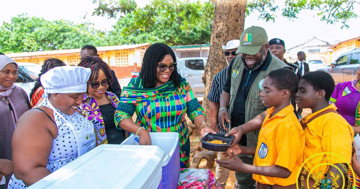 Ghanaian schoolchildren receiving hot nutritious meals through national school feeding program
