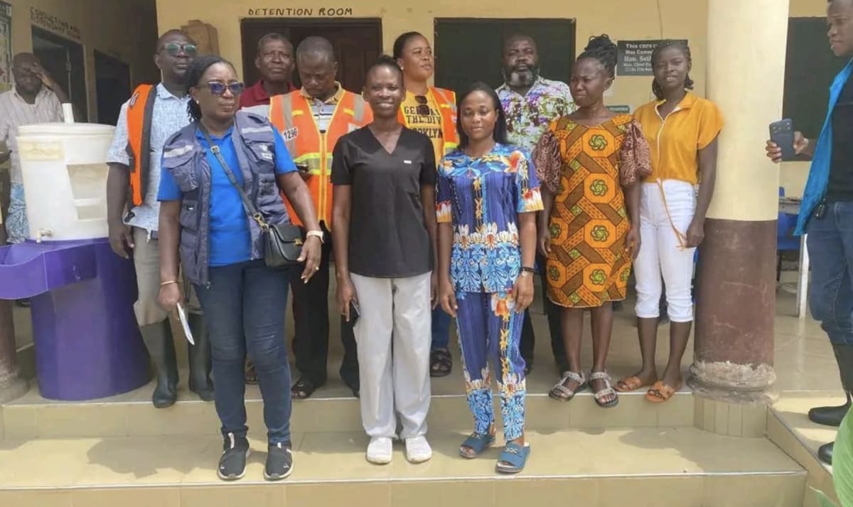 Disaster response team members engage with flood-affected community residents in Ghana's Keta Municipality