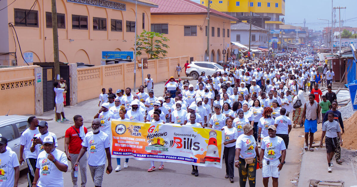 Thousands of participants walking together through Ghana streets during Homowo Health Walk celebration