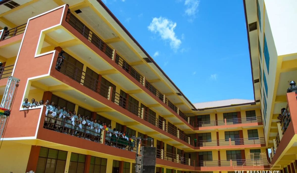 Students entering modern classroom building at Paga Senior High School in Ghana