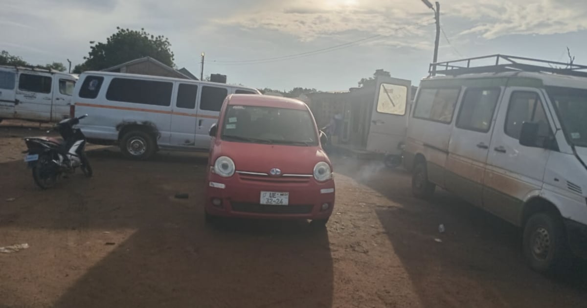 Modern passenger van traveling on improved paved road in northern Ghana countryside