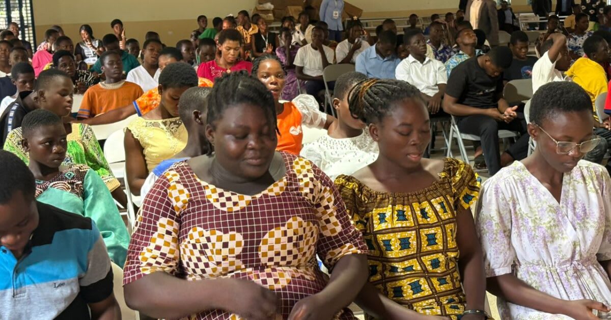 Young people attending technology and faith training conference at Baptist church in Ghana