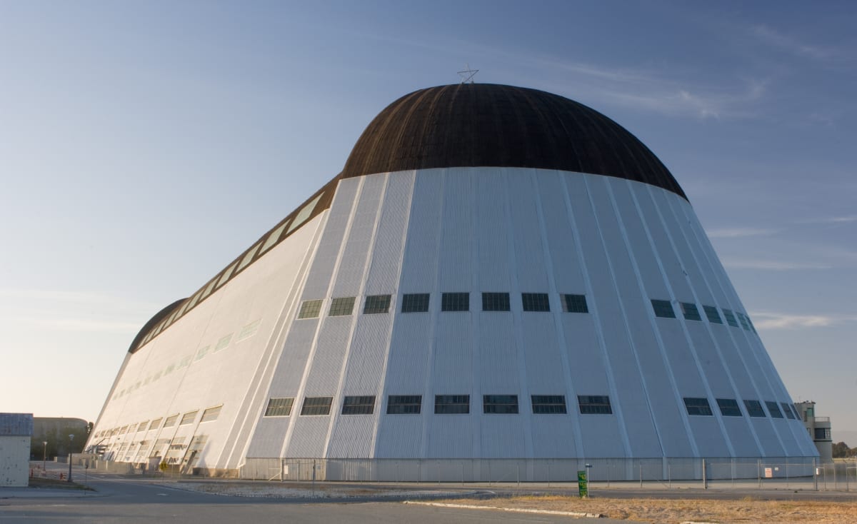 Historic Hangar One at Moffett Federal Airfield showing massive steel frame structure in California