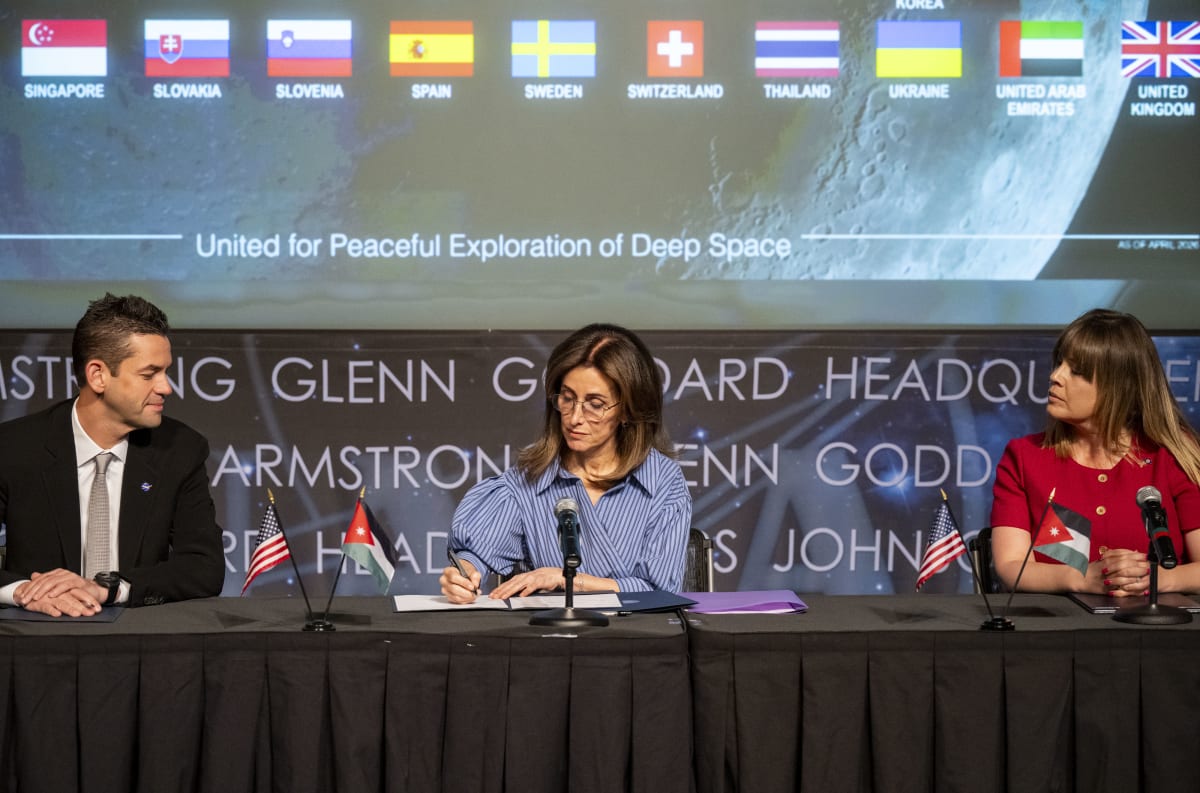 Jordan's Ambassador Dina Kawar signs Artemis Accords at NASA headquarters between Administrator Isaacman and State Department official
