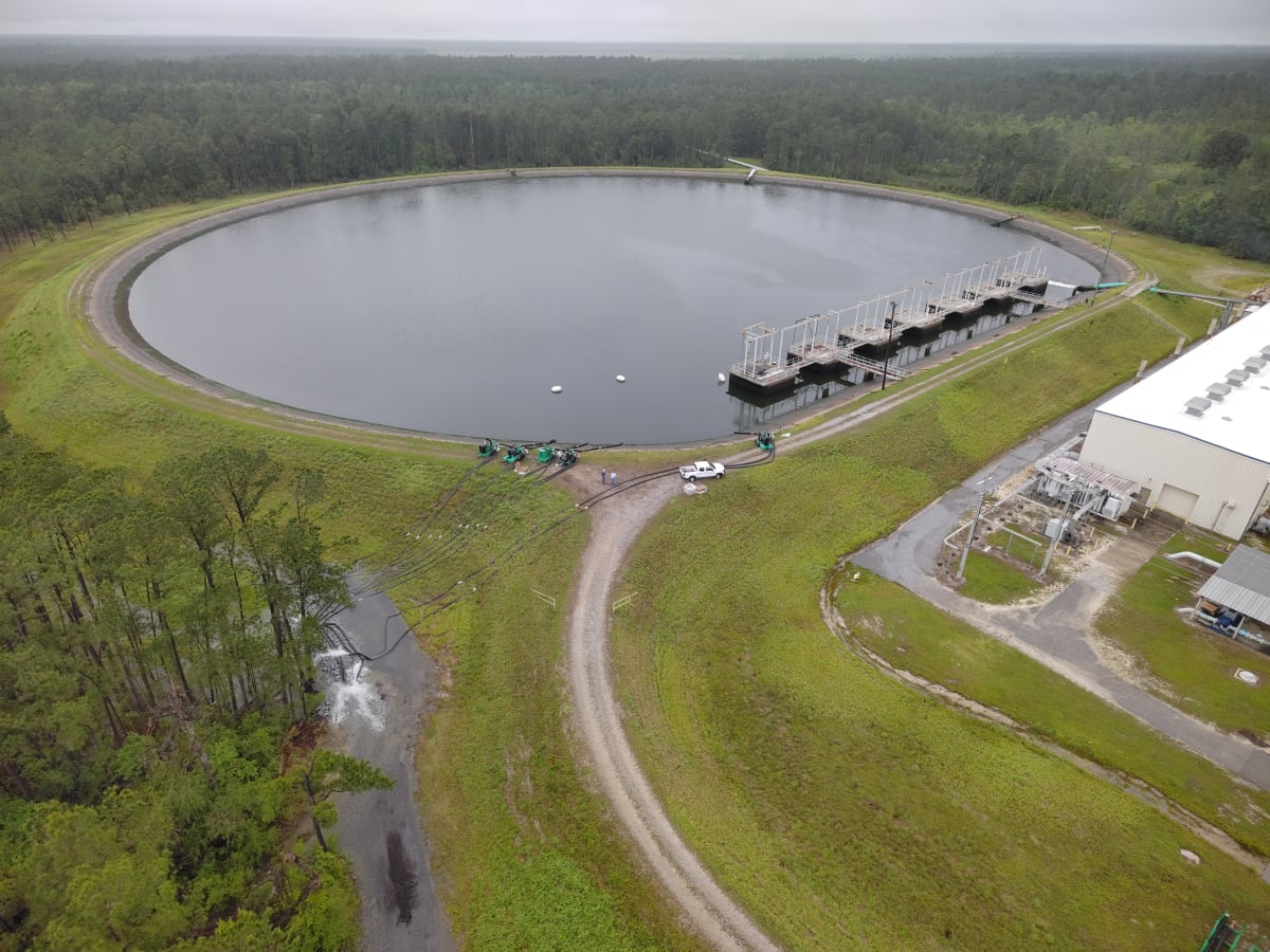 Aerial view of NASA's massive circular reservoir drained to reveal basin floor for first time since 1960s