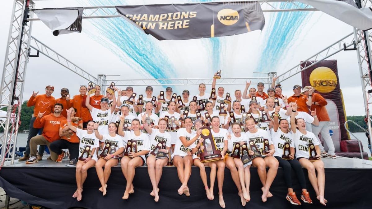 University of Texas rowing team celebrating with championship trophy at Lake Lanier Olympic Park