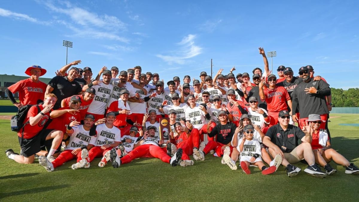 ** Tampa Spartans baseball team celebrates their third consecutive Division II national championship trophy