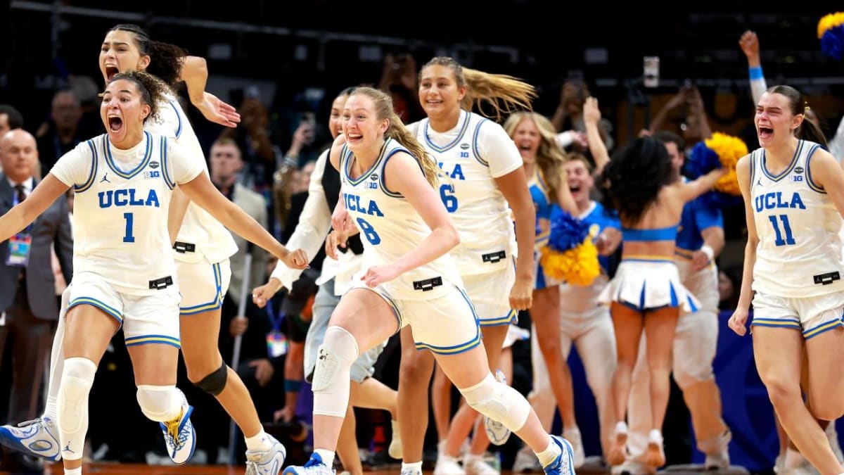 ** UCLA women's basketball team celebrating together after winning their first NCAA championship trophy