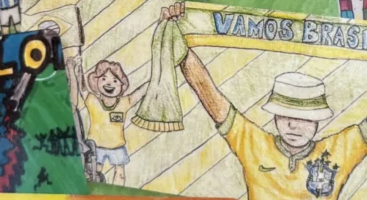 Young student Leo Silveira holding his colorful Vamos Brasil World Cup artwork design