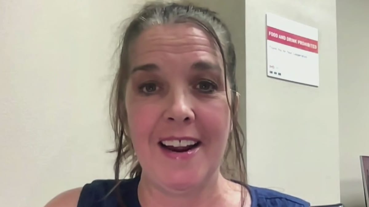 Family members embracing at airport hangar after emotional reunion in San Antonio, Texas