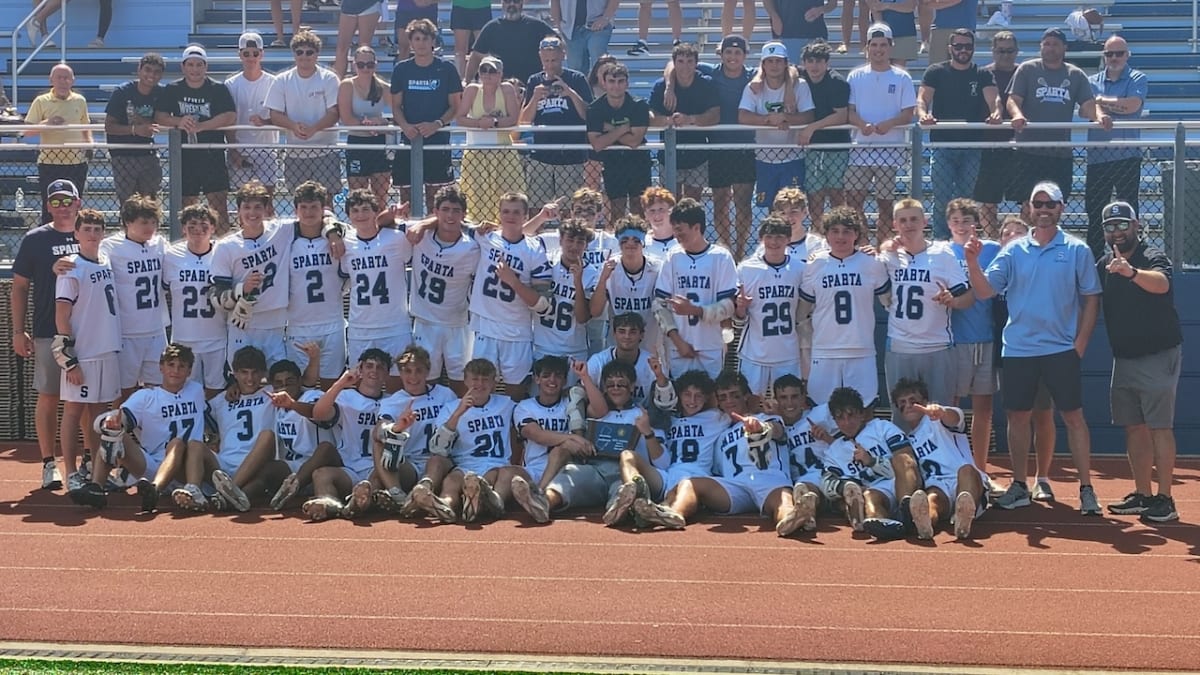 Sparta High School lacrosse players celebrating their first sectional championship victory on field