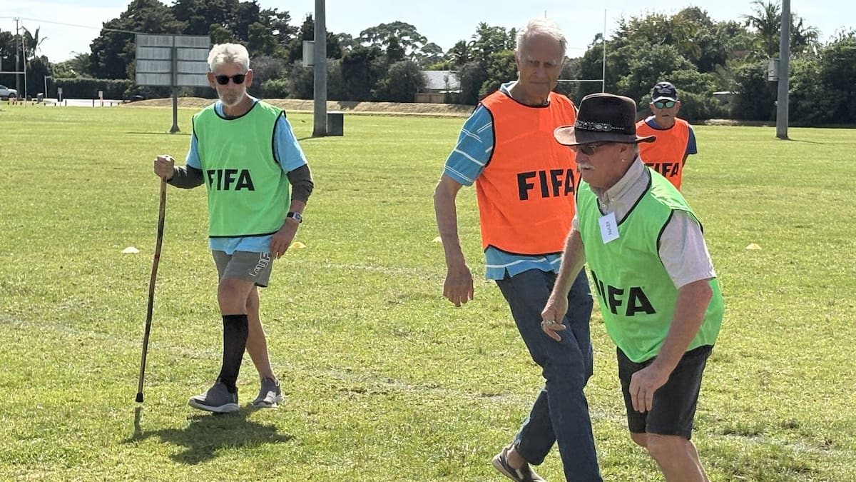 Seniors playing walking football with walking aids at Kerikeri Sporting Memories Club gathering